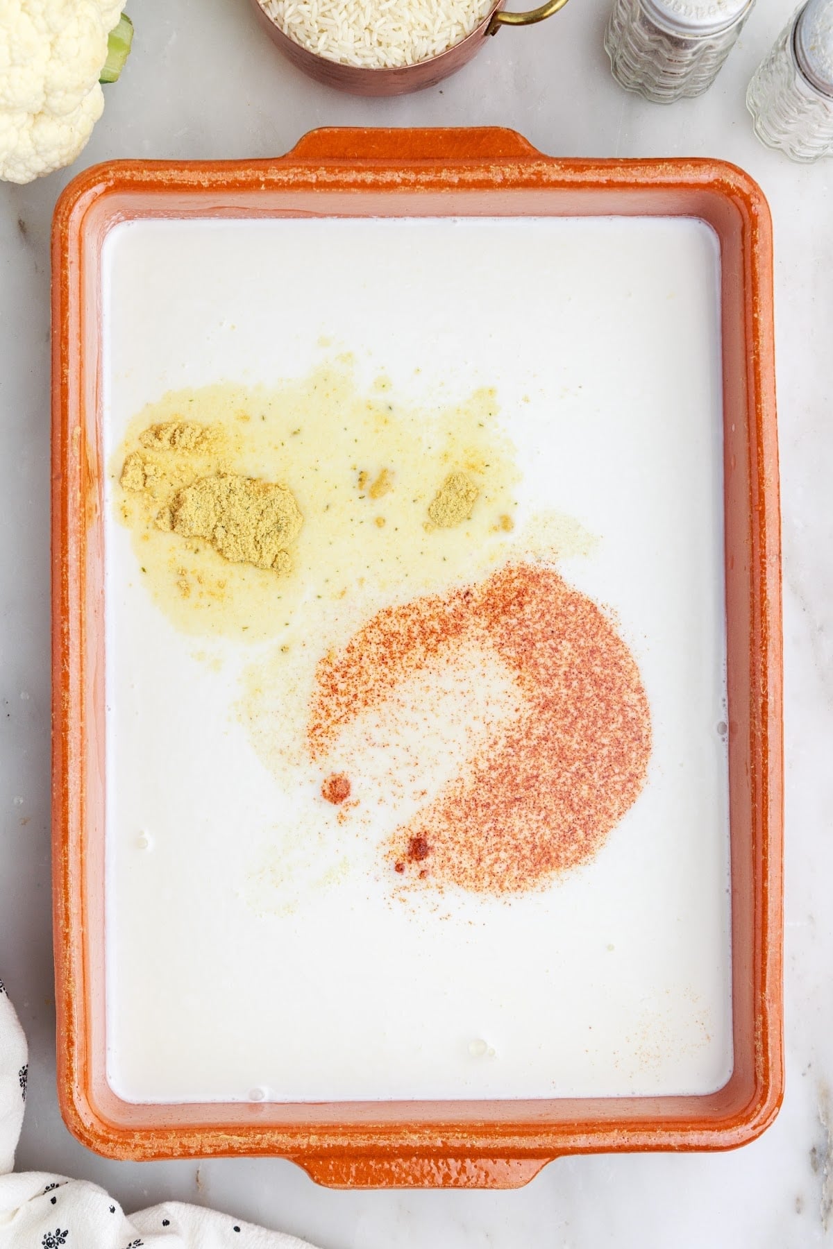 Butter, cornstarch, milk/cream, broth, and seasonings added and mixed directly to a baking dish.